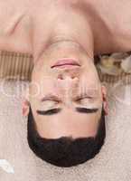 Caucasian handsome spa man ready to take massage