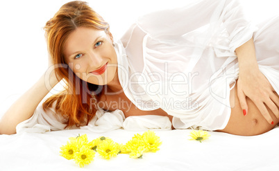 smiling pregnant beauty with flowers