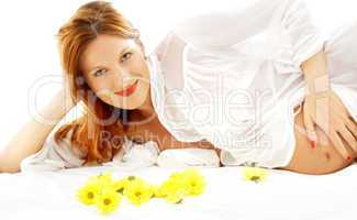 smiling pregnant beauty with flowers