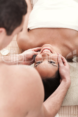 Man giving head massage to his girl friend