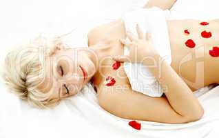 blond with rose petals in spa