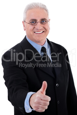Successful business man shows ok sign