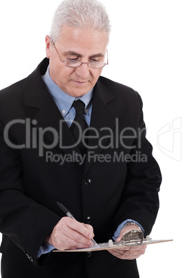 Confident senior business man writing on the clipboard