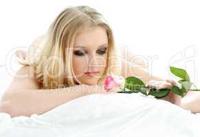 lovely blond with rose in bed