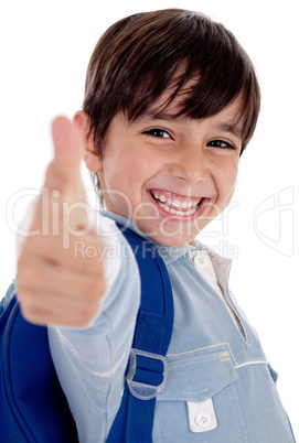 Smiling kinder garden boy gives thumbs up