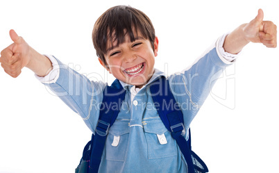 Cheerful school boy showing his thumbs up