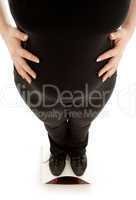 pregnant lady weighing oneself, focus on belly