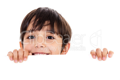 Young boy lifting his head out of the blank board