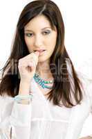 thoughtful brunette in white shirt