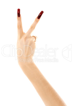 hand with long acrylic nails showing victory sign