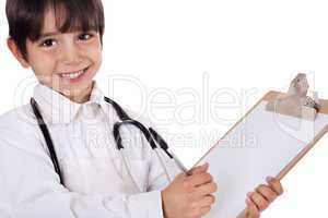 Little boy doctor writes on his clipboard for diagnosis