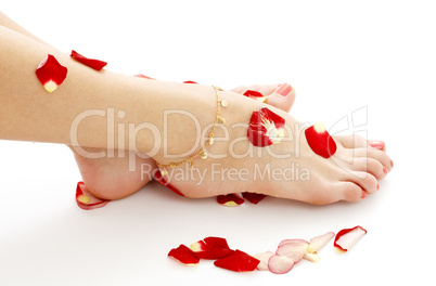 feet with petals in spa