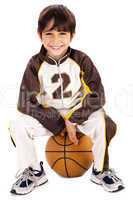 Kid stylishly sitting on the ball