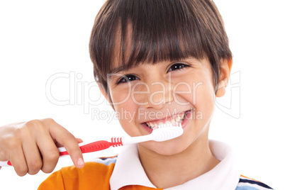 Closeup of cute kid brushing his teeth
