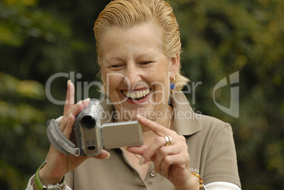 middle aged women with a camera