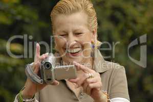 middle aged women with a camera