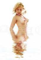topless lady with pink beads in water
