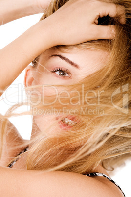 Young model with beautiful hair covered her face