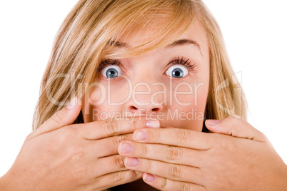 Closeup of young women covering her mouth with both hands