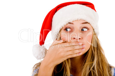 Closeup of young women covering her mouth with both hands