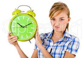 Girl giving funny expression and holding the alarm