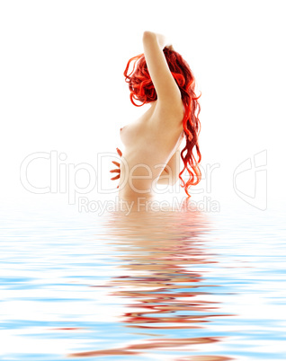 topless redhead in blue water