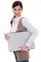 young womencarrying a laptop