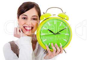 attractive young model smiling and holding the clock
