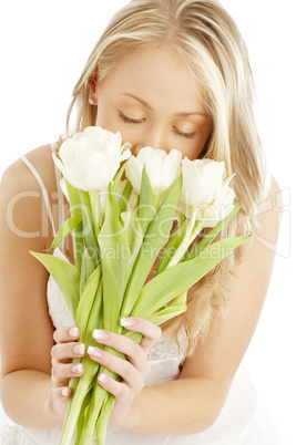 happy blond with white tulips