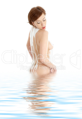 topless girl with soap foam on spine in water
