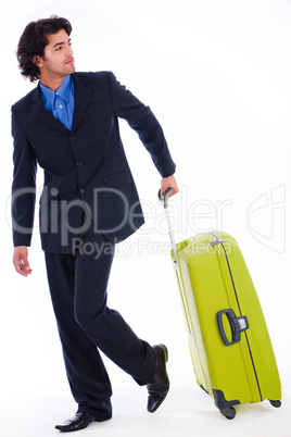 Corporate man looking back with the luggage