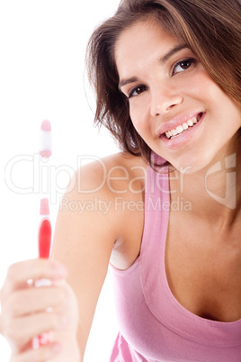 happy young women showing her toothbrush