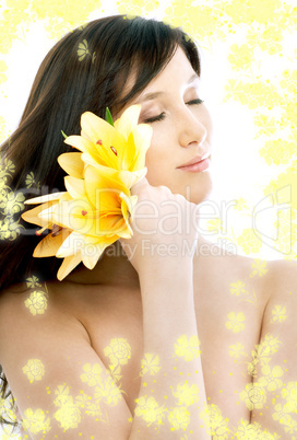 brunette with yellow flowers in spa