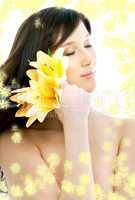 brunette with yellow flowers in spa