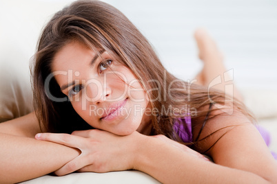 happy fresh teenage girl laying on th sofa