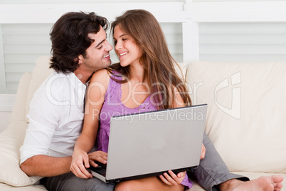 romantic young couple with laptop