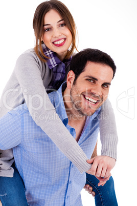 Cheerful young couple piggybacking