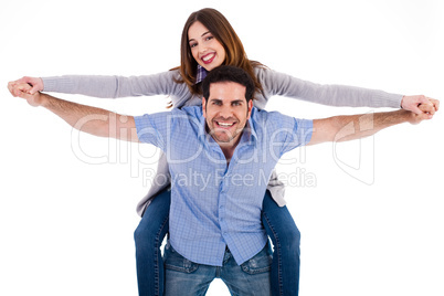 Front view of a couple in piggy back ride