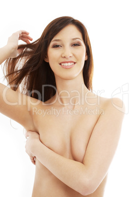 smiling topless brunette with long hair