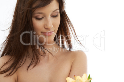 happy brunette with yellow lily flowers