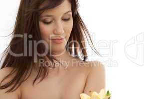 happy brunette with yellow lily flowers