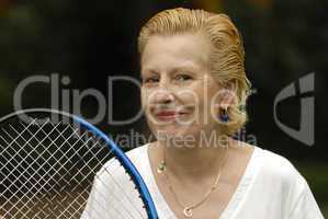 middle-aged woman with tennis racket