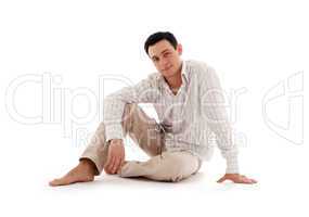 relaxed man sitting on the floor