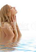 healthy blond with closed eyes in water