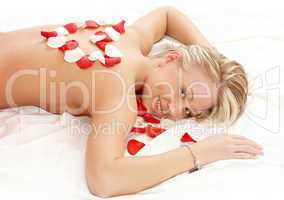 girl with heart-shaped petals in massage salon