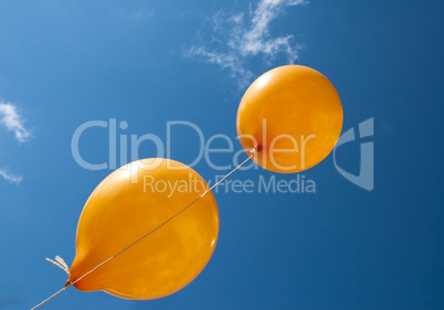 Two orange balloons
