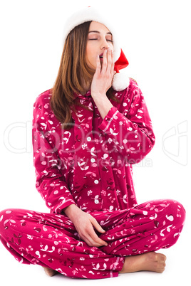 Santa girl sitting and yawning