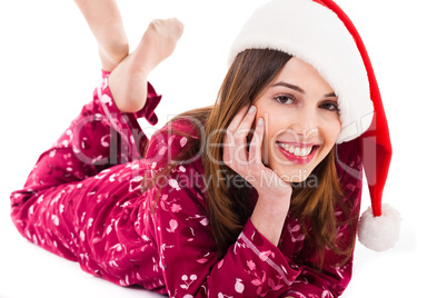 Santa girl relaxing by lying down and smiling