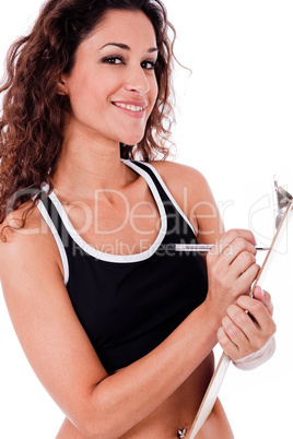 Fitness woman writing on a clip board