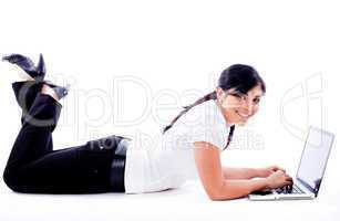 Business woman lying with laptop